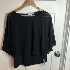 Black size small top NWT. Flowy mesh arms. This shirt is adorable